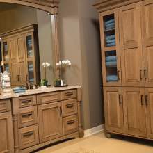 A large, organized and functional kitchen featuring a spacious vanity and a three-section cabinet with wooden doors.